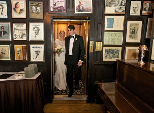 Nicole and Eric enter the reception at the Lotus Club